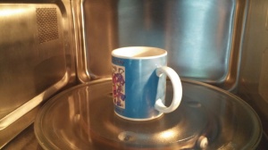 place mug in microwave.